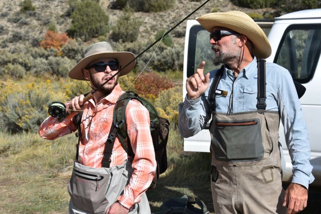 fly fishing guide coaching a guest